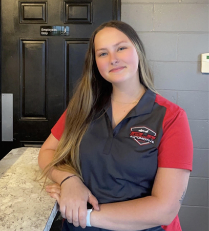 Dakota of GLP Automotive standing next to the service desk