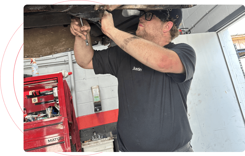 auto mechanic under car